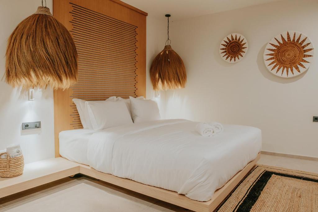 Voodi või voodid majutusasutuse Somnus Suites Parga toas