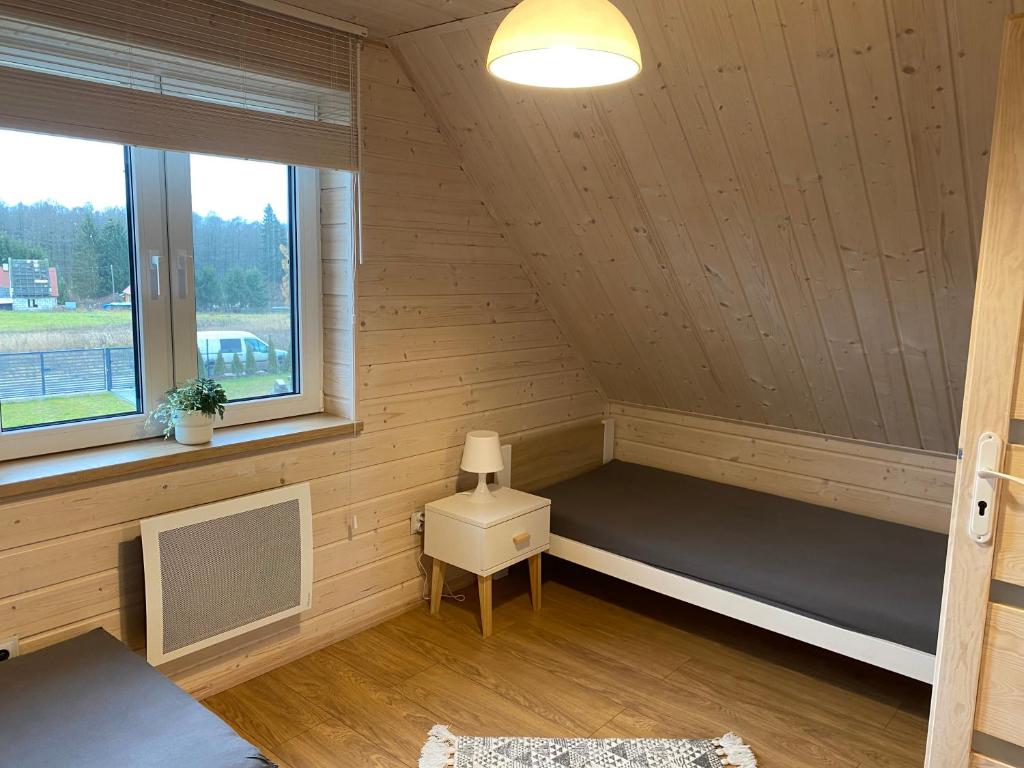 Posteľ alebo postele v izbe v ubytovaní Domek Całoroczny Fuleda -Mazury Giżycko Sauna Jacuzii Kominek