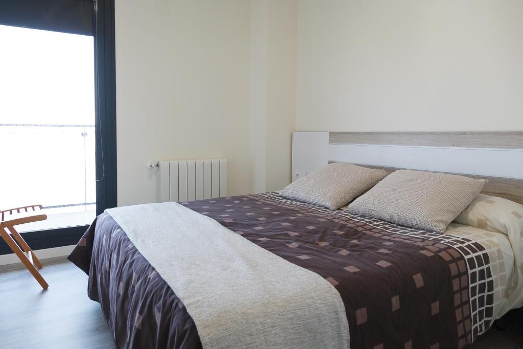Postel nebo postele na pokoji v ubytování UHC Salou Residencial