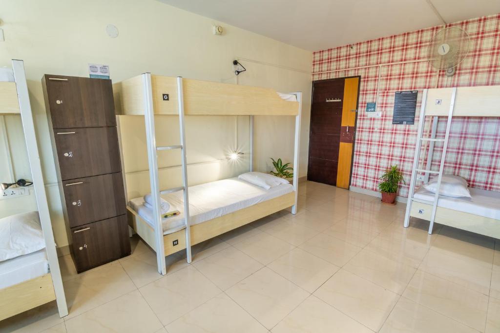 Postel nebo postele na pokoji v ubytování Offbeat CCU