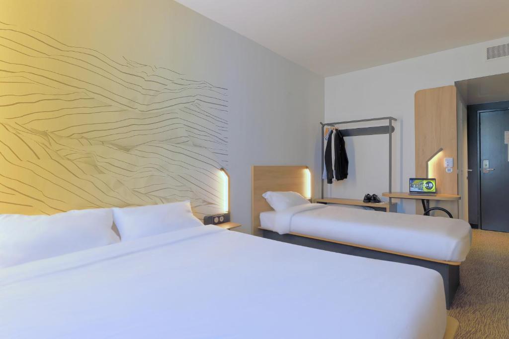 Postel nebo postele na pokoji v ubytování B&B HOTEL Le Touquet
