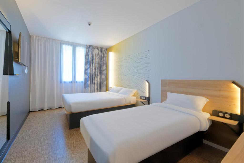 Postel nebo postele na pokoji v ubytování B&B HOTEL Le Touquet