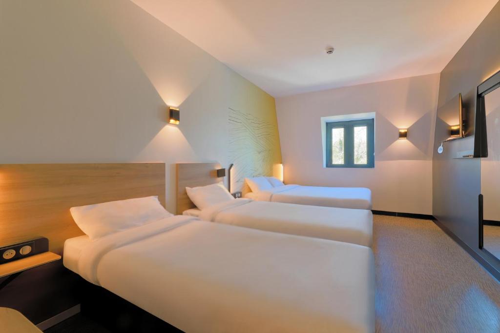 Postel nebo postele na pokoji v ubytování B&B HOTEL Le Touquet