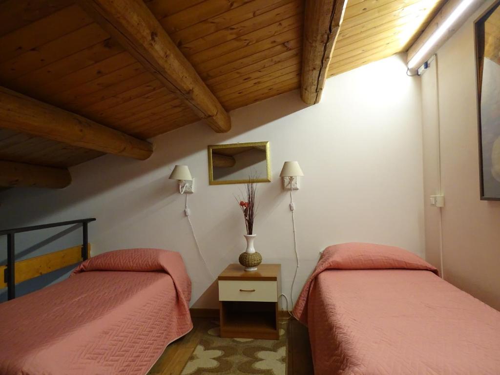 Postel nebo postele na pokoji v ubytování B&B Vinci