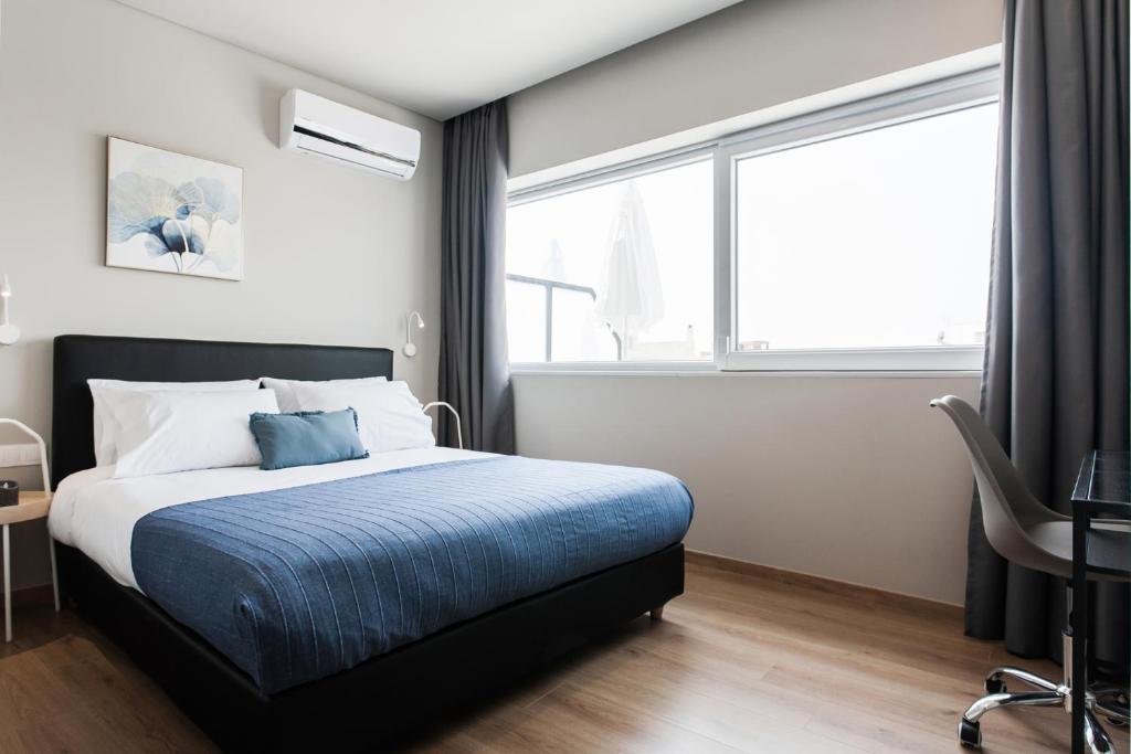 Posteľ alebo postele v izbe v ubytovaní WYZ Attiki Aparthotel