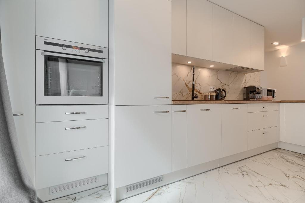 Kuchyňa alebo kuchynka v ubytovaní Apartament Prezydencki bulwary Stare Miasto Apartamenty No 1