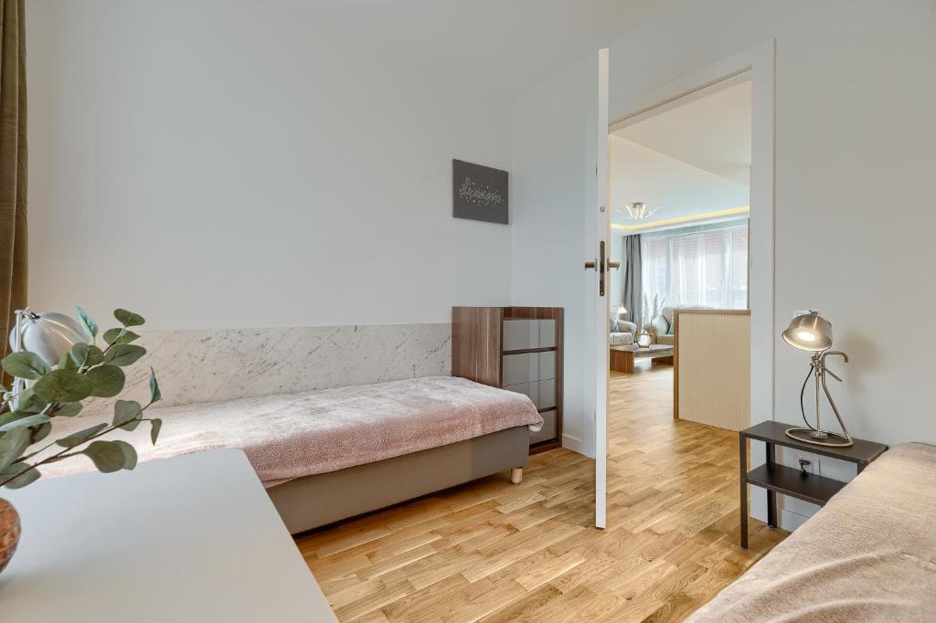 Posteľ alebo postele v izbe v ubytovaní Apartament Prezydencki bulwary Stare Miasto Apartamenty No 1