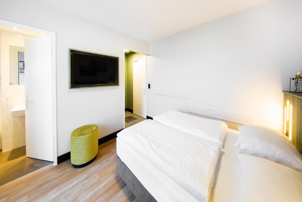 Postel nebo postele na pokoji v ubytování fjord hotel berlin