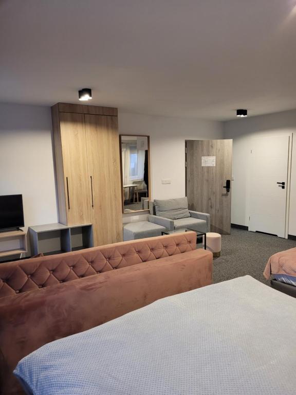 Posteľ alebo postele v izbe v ubytovaní Silesia Apartments