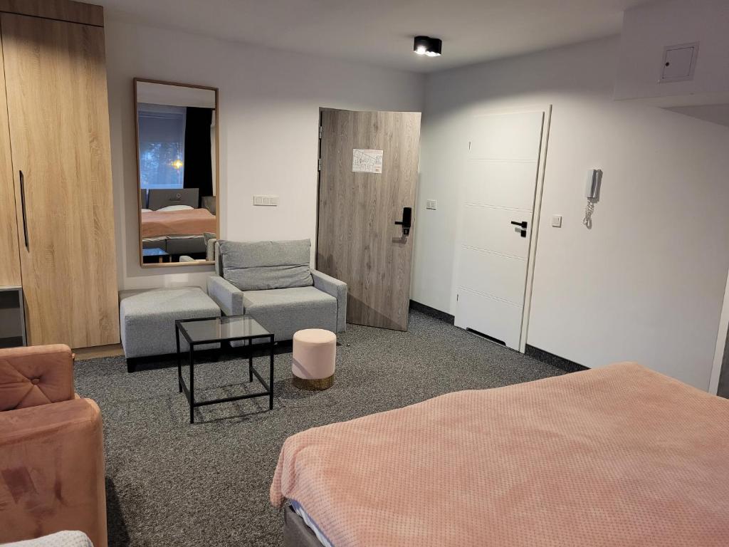 Posteľ alebo postele v izbe v ubytovaní Silesia Apartments