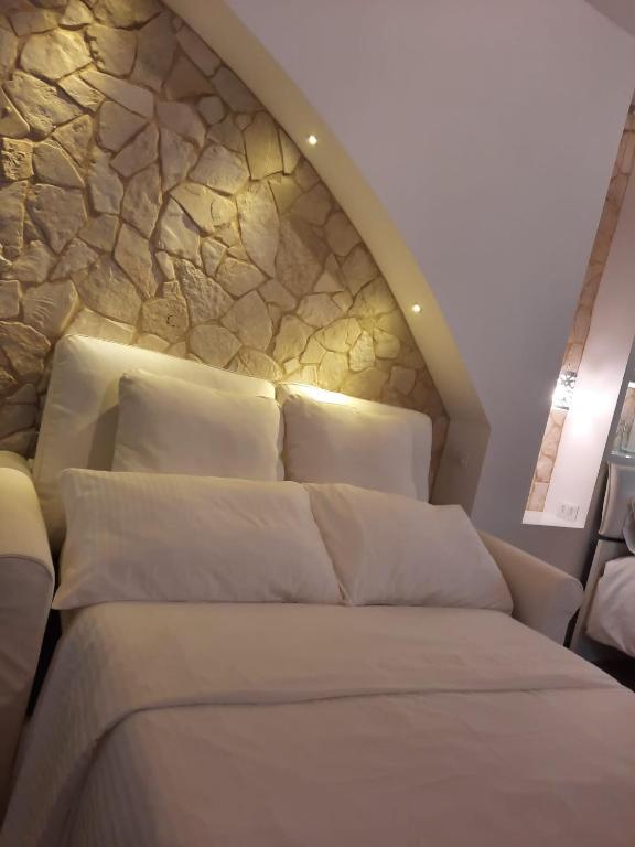 Łóżko lub łóżka w pokoju w obiekcie Cocciu D'amuri Luxury