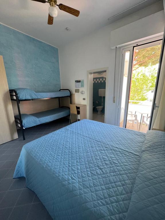 Postel nebo postele na pokoji v ubytování Hotel Villa dei Fiori - sul mare con piscina