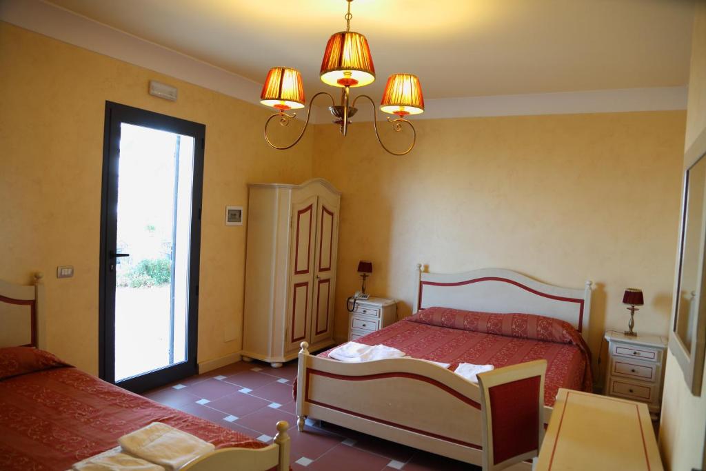 Posteľ alebo postele v izbe v ubytovaní Agriturismo Monticelli