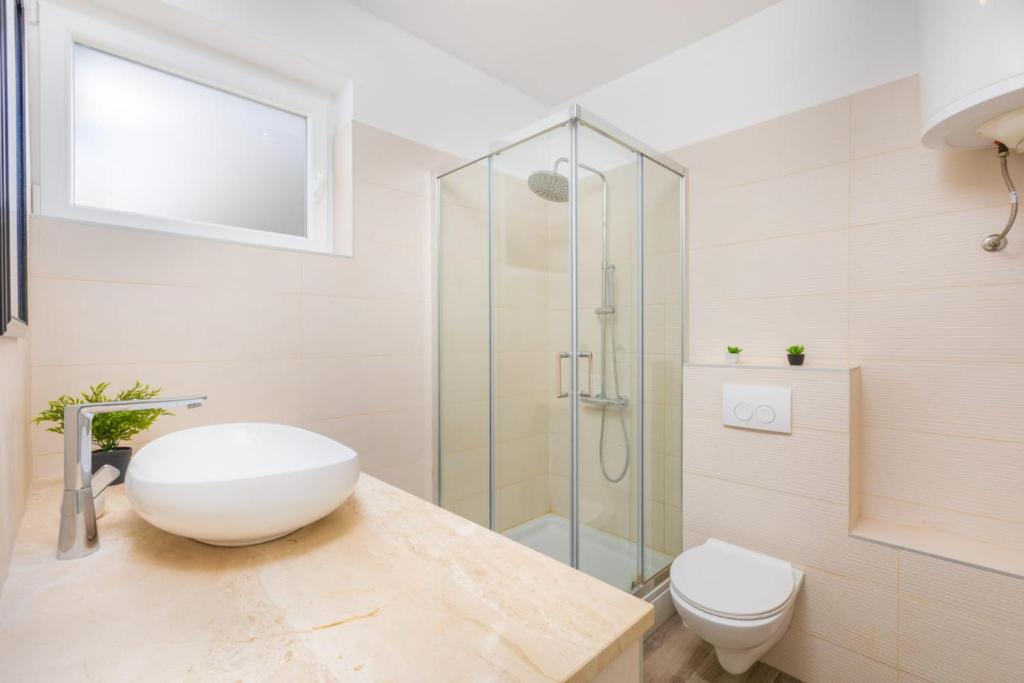 Kúpeľňa v ubytovaní Apartman Dokić 3