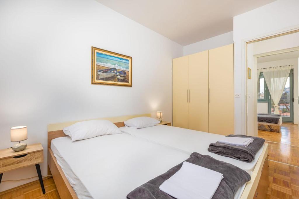 Posteľ alebo postele v izbe v ubytovaní Apartman Dokić 3