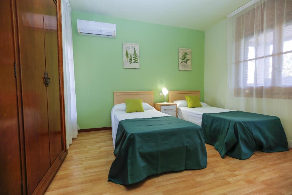 Posteľ alebo postele v izbe v ubytovaní GERANIS VILLA ONLY FAMILIES Planet Costa Dorada