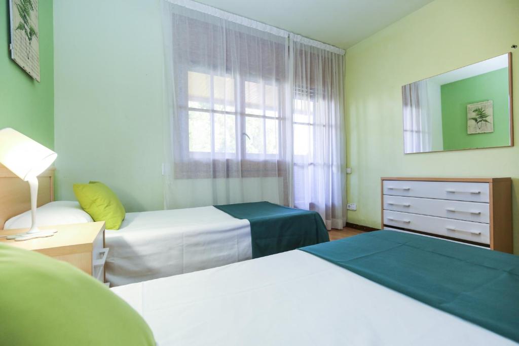 Posteľ alebo postele v izbe v ubytovaní GERANIS VILLA ONLY FAMILIES Planet Costa Dorada