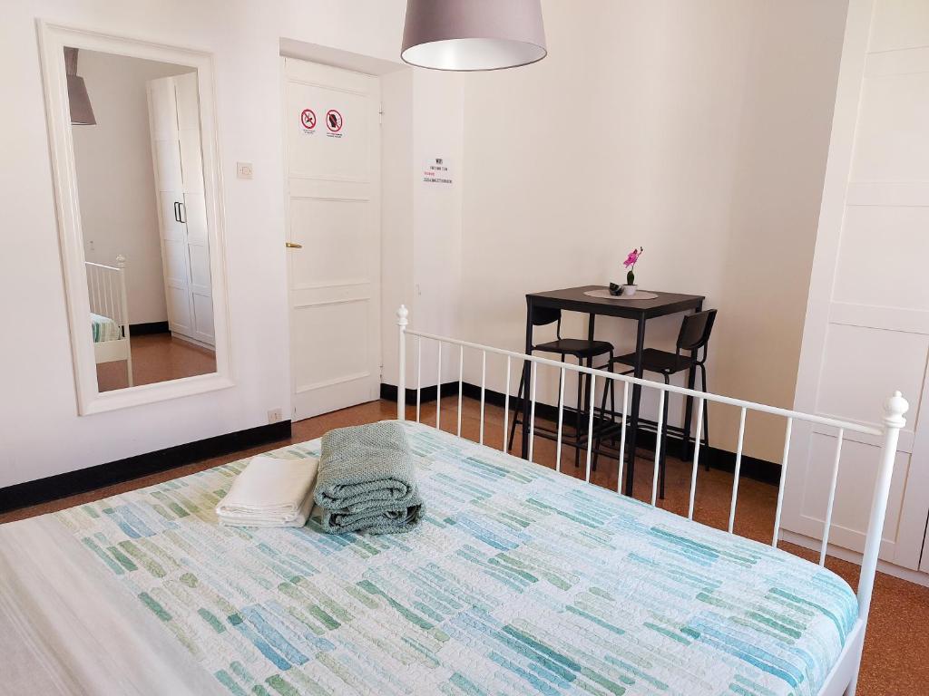 Postel nebo postele na pokoji v ubytování Brignole C Genova Rooms