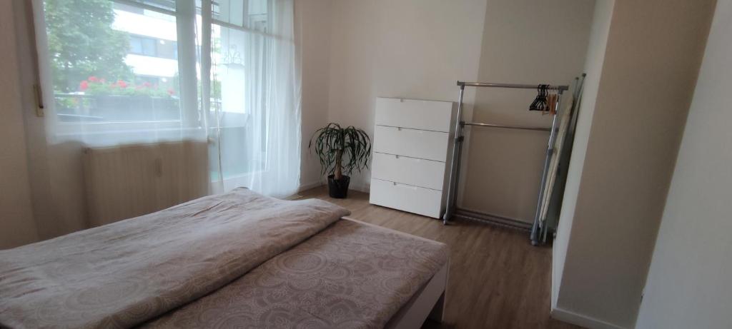 Postel nebo postele na pokoji v ubytování Lake FeWo Santorini