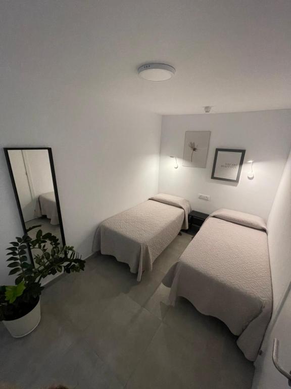 Łóżko lub łóżka w pokoju w obiekcie Apartamento JOSE