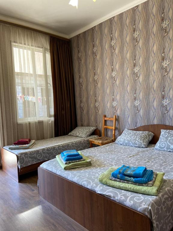 Postel nebo postele na pokoji v ubytování Уютный Дворик