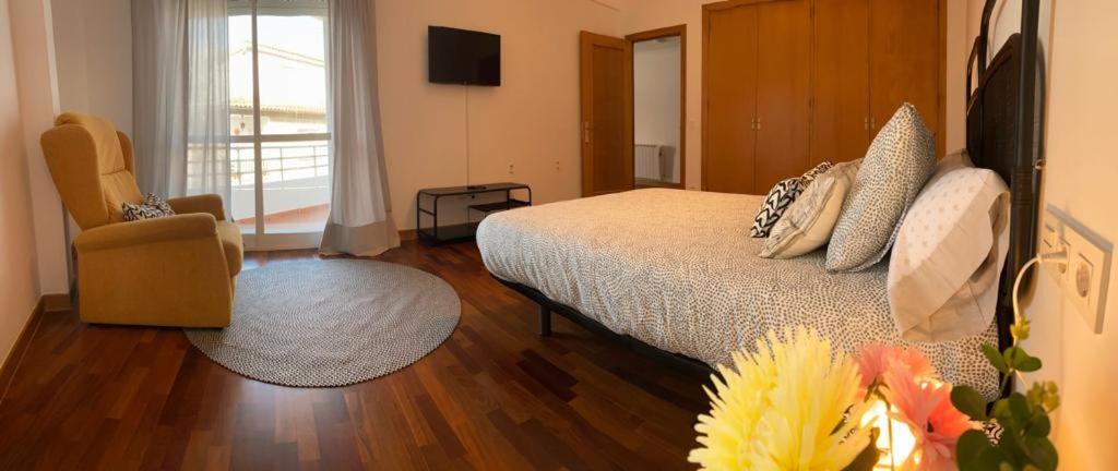 Postel nebo postele na pokoji v ubytování Combarro Suite
