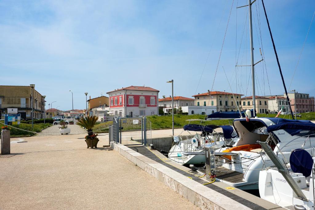a bunch of boats are docked at a marina at Villino Ermione in Marina di Pisa