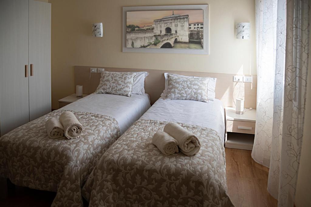 Voodi või voodid majutusasutuse Treviso Rooms toas