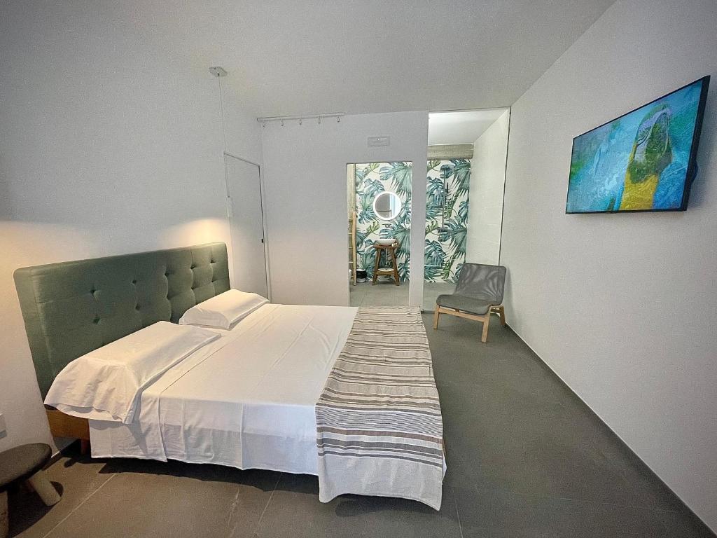 Postel nebo postele na pokoji v ubytování Tropicana Suite - Adults Only