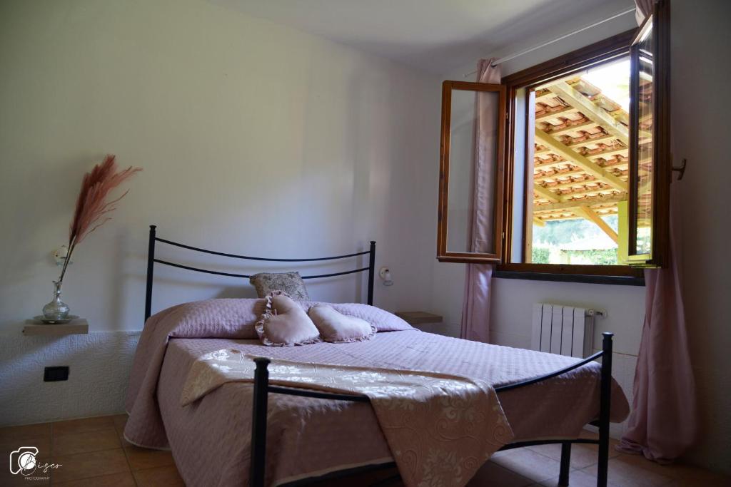 A bed or beds in a room at Casa Verde Country House