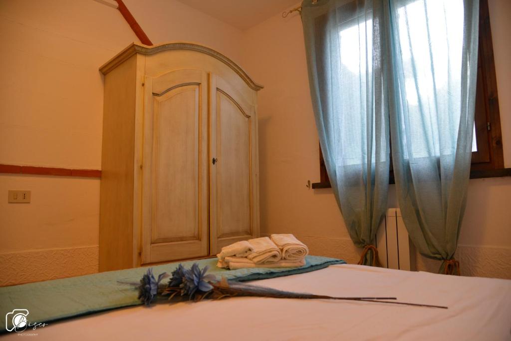 A bed or beds in a room at Casa Verde Country House