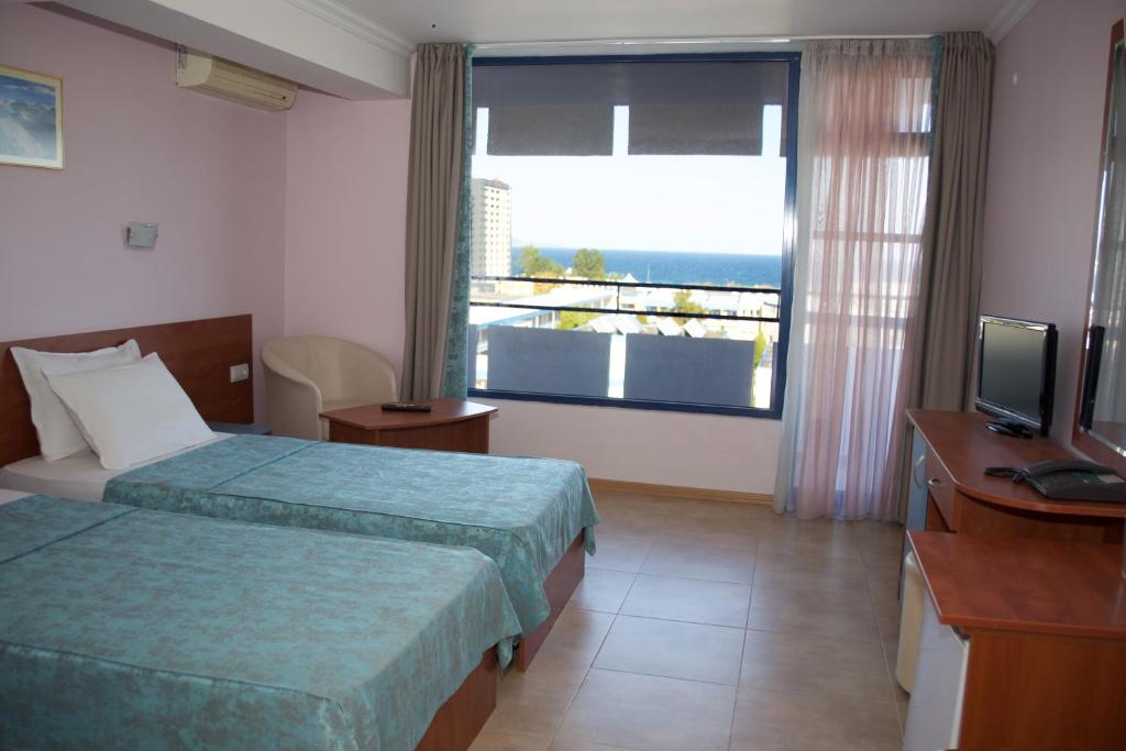 Postel nebo postele na pokoji v ubytování Dunav Hotel