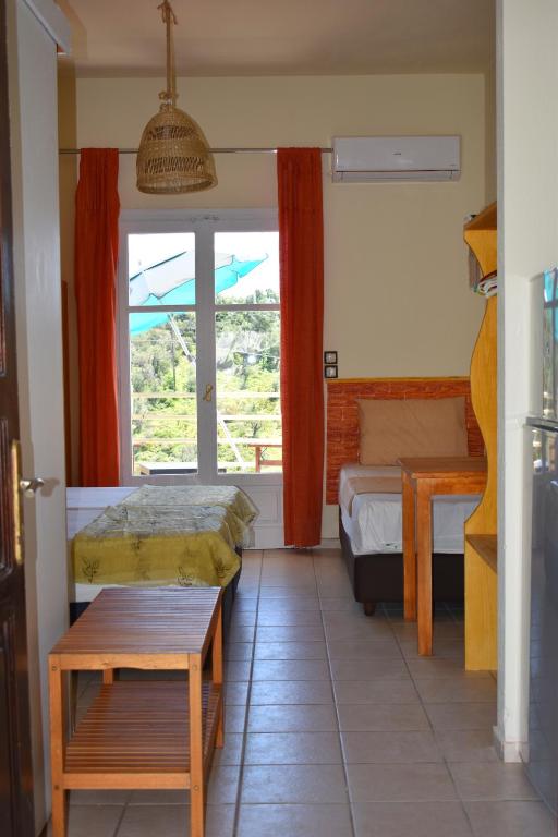 Postel nebo postele na pokoji v ubytování Villa Krini
