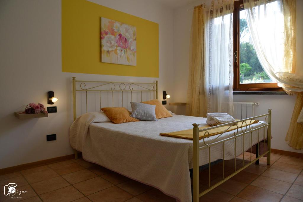 A bed or beds in a room at Casa Verde Country House