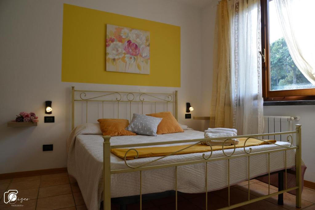 A bed or beds in a room at Casa Verde Country House