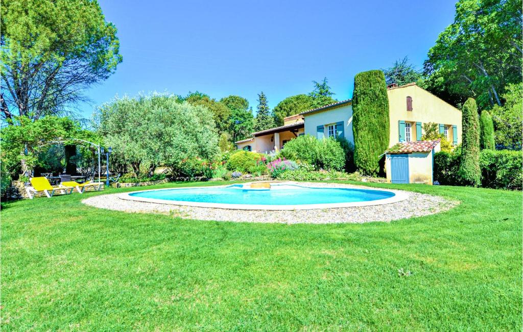 a swimming pool in a yard with a house at Gorgeous Home In Montaren Et St Mediers in Labaume