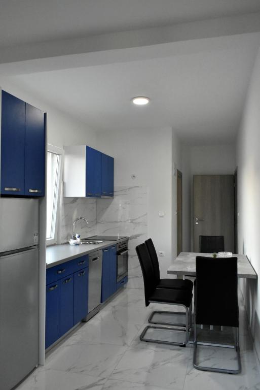 Kuchyň nebo kuchyňský kout v ubytování Apartmani Škorpion