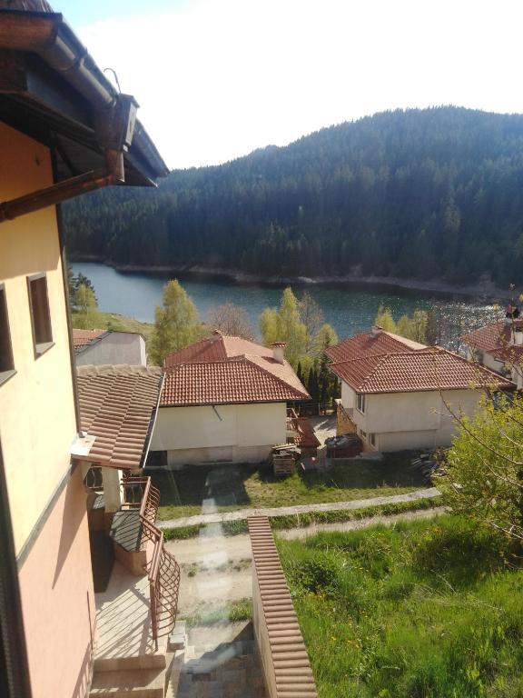 a view from a building with a view of a lake at Вила Родопи in Dospat