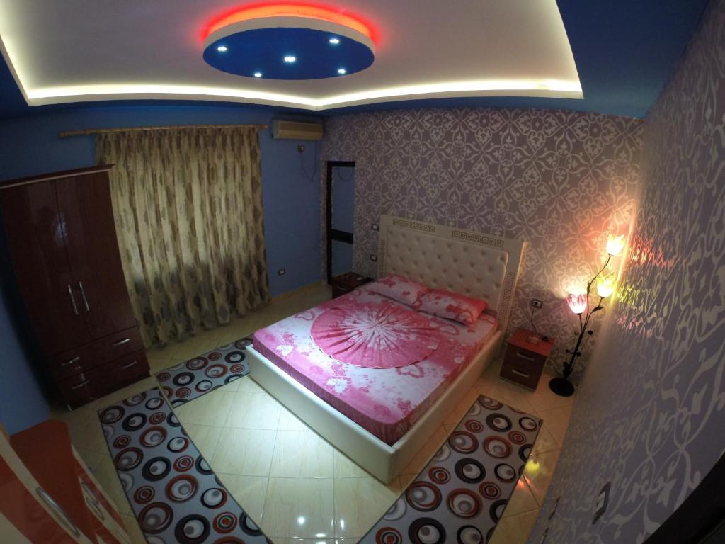 Postel nebo postele na pokoji v ubytování Hotel Buza