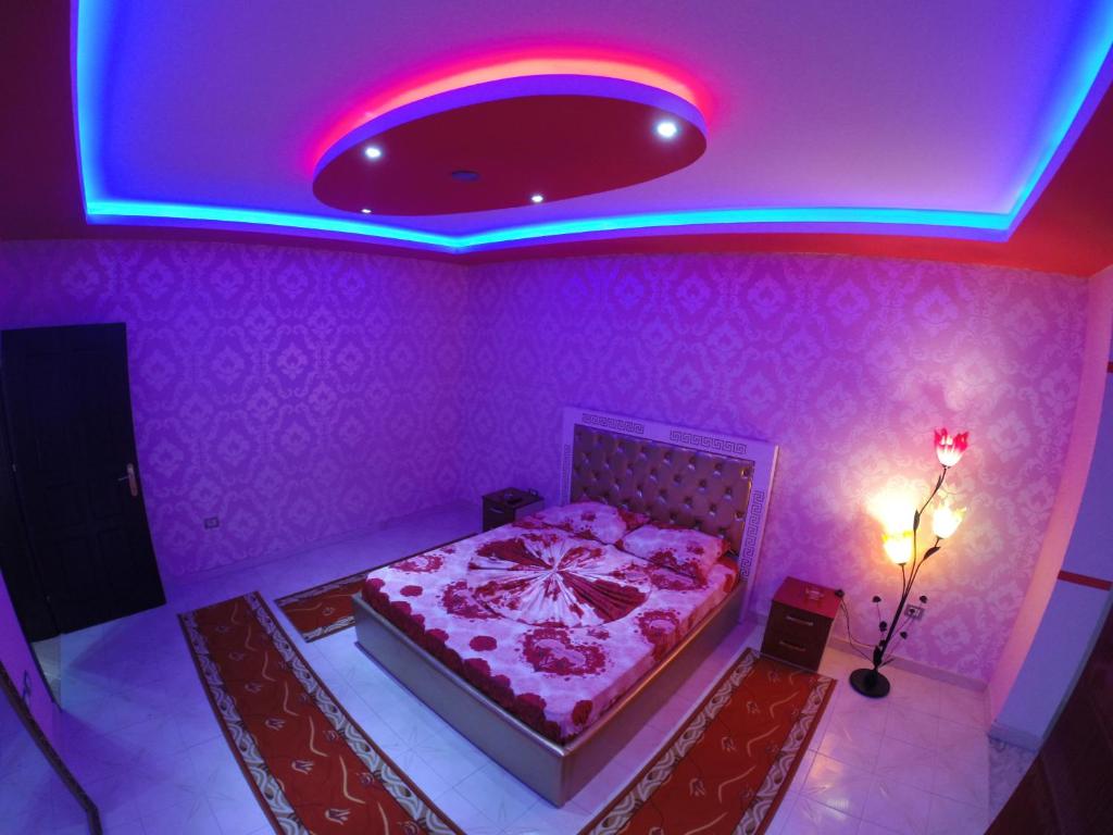Postel nebo postele na pokoji v ubytování Hotel Buza