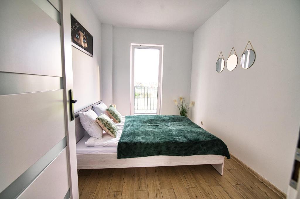 Posteľ alebo postele v izbe v ubytovaní Apartament The Palm 35 by Housine
