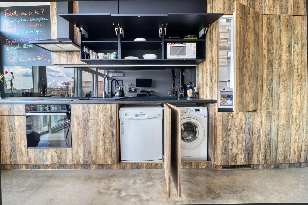 Kuchyňa alebo kuchynka v ubytovaní HAB Home Apartman
