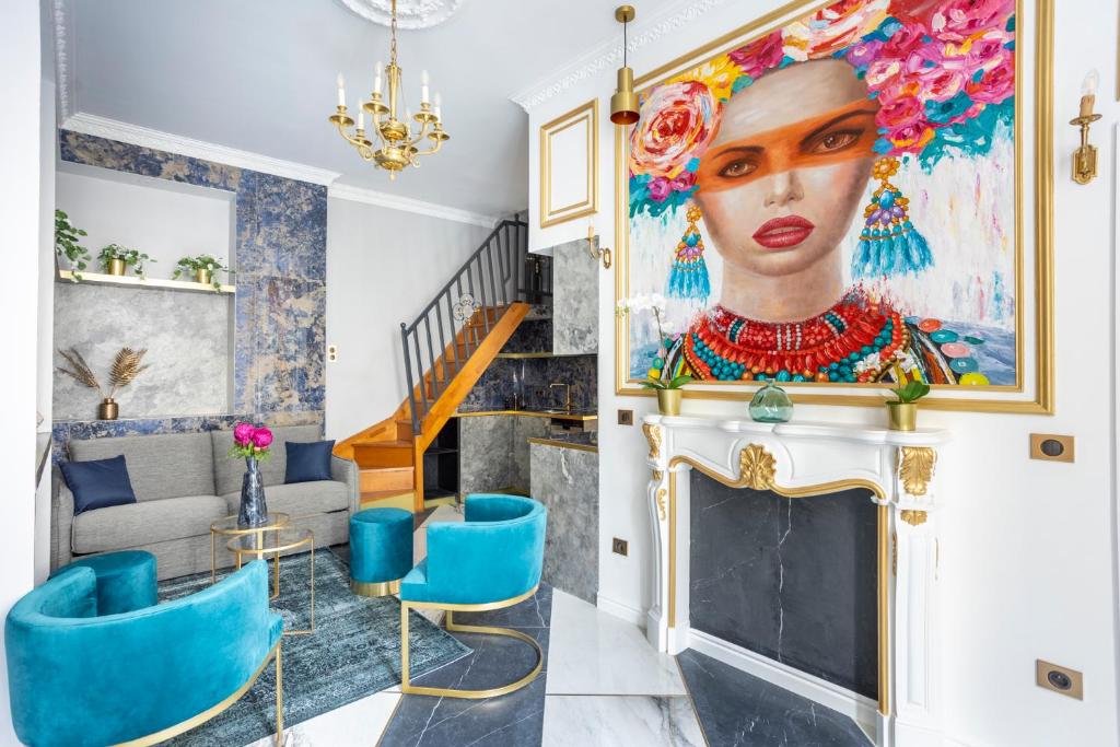 a living room with a painting of a woman at Luxury 3 bedrooms 2 Bathrooms - Ile saint-Louis in Paris