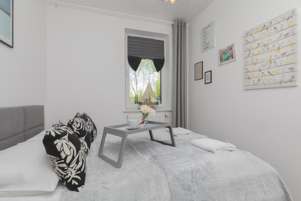 Posteľ alebo postele v izbe v ubytovaní Osiedle Feniks Kołobrzeg by Noclegi Renters