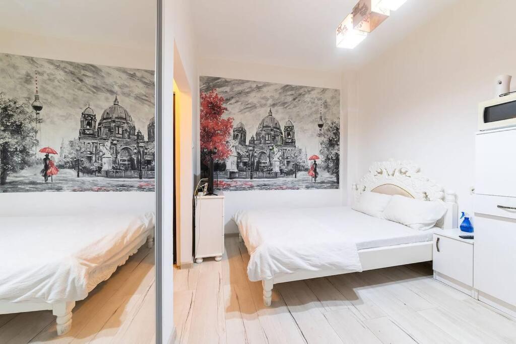 Postelja oz. postelje v sobi nastanitve CozyBucharest Studio