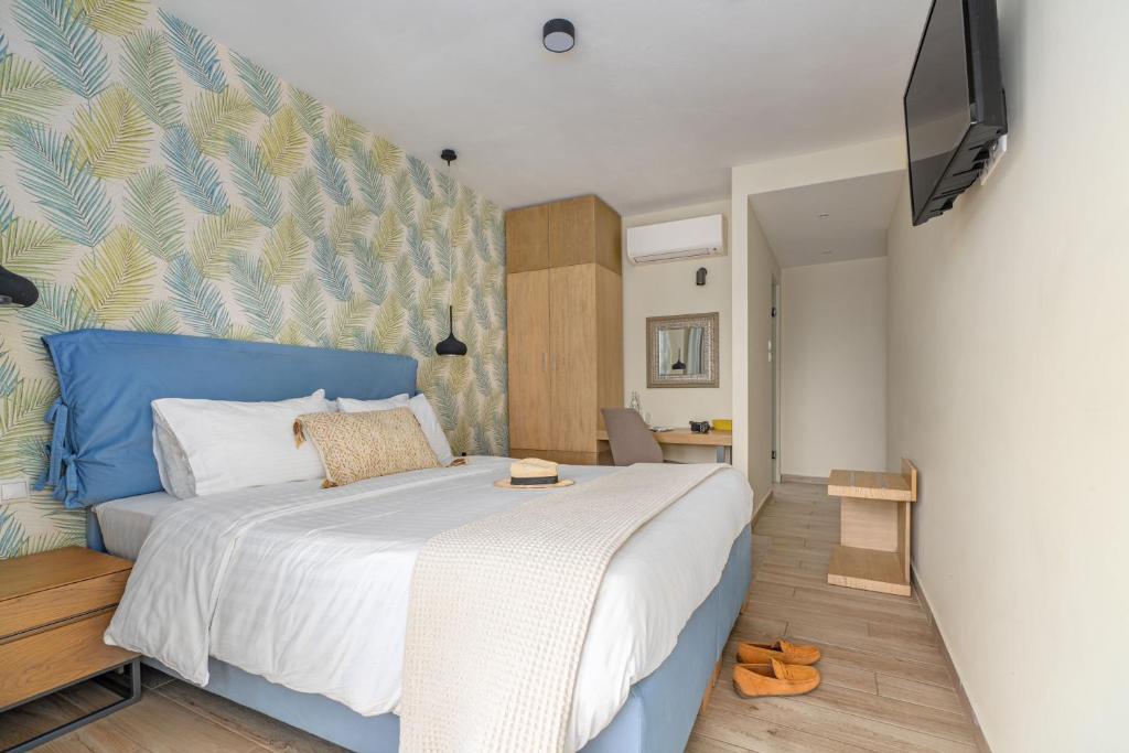 Ένα ή περισσότερα κρεβάτια σε δωμάτιο στο Maison 66, Riviera Hotels