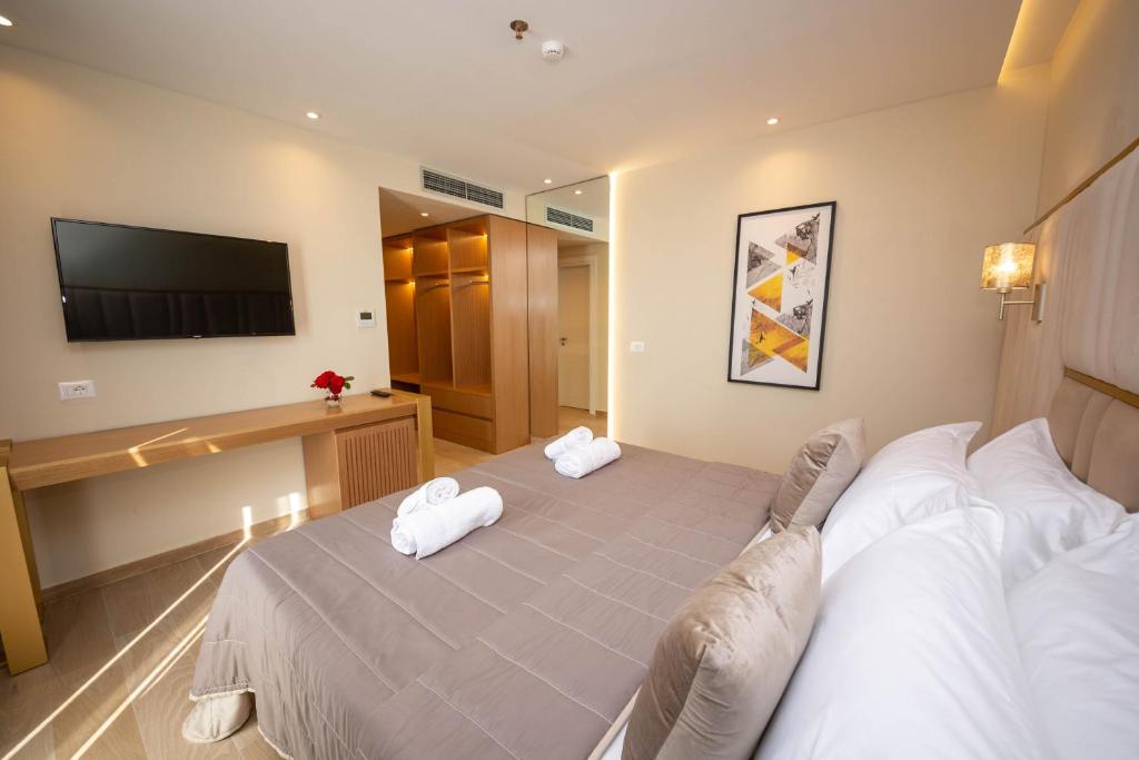 Postel nebo postele na pokoji v ubytování Merar Hotel