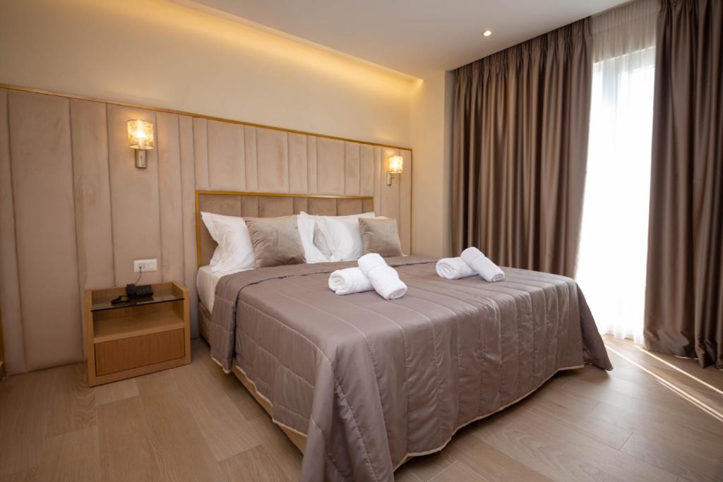 Postel nebo postele na pokoji v ubytování Merar Hotel