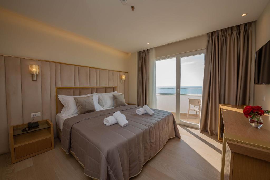 Postel nebo postele na pokoji v ubytování Merar Hotel