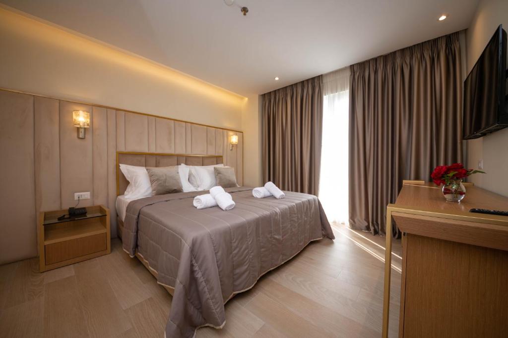 Postel nebo postele na pokoji v ubytování Merar Hotel